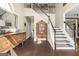 Grand entryway featuring hardwood floors, elegant staircase, and antique furniture at 2715 Ivey Crossing Trl, Cumming, GA 30041