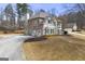 Charming two-story home featuring a side-entry garage and mature trees at 2715 Ivey Crossing Trl, Cumming, GA 30041
