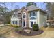 Charming two-story home featuring stone accents, blue shutters, and a well-manicured front yard at 2715 Ivey Crossing Trl, Cumming, GA 30041