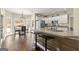 Eat-in kitchen with granite countertops, stainless appliances, and bar stool seating at 2715 Ivey Crossing Trl, Cumming, GA 30041