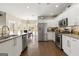 Bright kitchen featuring white cabinetry, stainless steel appliances, and granite countertops at 2715 Ivey Crossing Trl, Cumming, GA 30041