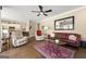 Inviting living room with hardwood floors, plush seating, and stylish decor at 2715 Ivey Crossing Trl, Cumming, GA 30041