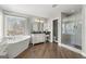 Beautiful main bathroom with soaking tub, walk-in shower, and granite counters at 2715 Ivey Crossing Trl, Cumming, GA 30041
