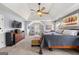 Spacious main bedroom with a ceiling fan, sitting area, and decorative art at 2715 Ivey Crossing Trl, Cumming, GA 30041