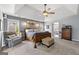 Relaxing main bedroom suite featuring a trey ceiling, ceiling fan, and ample natural light at 2715 Ivey Crossing Trl, Cumming, GA 30041