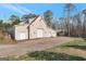 Large detached garage with multiple bays and a covered area, perfect for car enthusiasts at 2585 Braselton Hwy, Buford, GA 30519