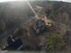 Ariel view of home nestled in the surrounding woods and neighborhood at 5700 Thrasher Sw Ln, Conyers, GA 30094