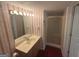 Bathroom with an elongated single sink vanity and a stand up shower at 5700 Thrasher Sw Ln, Conyers, GA 30094