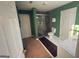 Green bathroom with carpet, walk in shower, toilet and vanity at 5700 Thrasher Sw Ln, Conyers, GA 30094