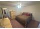 Carpeted bedroom with ceiling fan and standard closet at 5700 Thrasher Sw Ln, Conyers, GA 30094