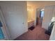 Hallway leading to a bathroom and attic bedroom at 5700 Thrasher Sw Ln, Conyers, GA 30094
