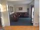 Spacious living room with a comfortable leather sectional sofa at 5700 Thrasher Sw Ln, Conyers, GA 30094