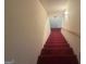 Carpeted stairs leading up to the next floor at 5700 Thrasher Sw Ln, Conyers, GA 30094