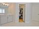 Vanity with drawers in bathroom plus open door to walk-in closet at 446 Bandon Way, Peachtree City, GA 30269