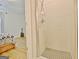Tiled shower stall featuring glass doors and chrome fixtures next to a bedroom at 446 Bandon Way, Peachtree City, GA 30269