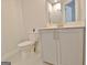 Cozy bathroom with white toilet and gray vanity featuring a white countertop and silver hardware at 446 Bandon Way, Peachtree City, GA 30269