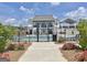 Gated community pool with a modern clubhouse offering a resort-like experience at 446 Bandon Way, Peachtree City, GA 30269