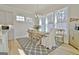 Bright dining area with natural lighting, a stylish table, and elegant decor at 446 Bandon Way, Peachtree City, GA 30269