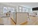 Kitchen island with stainless steel appliances, view of dining area, and open to living area with a fireplace at 446 Bandon Way, Peachtree City, GA 30269
