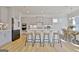 Spacious kitchen with an island, stainless steel appliances, and adjacent dining area at 446 Bandon Way, Peachtree City, GA 30269