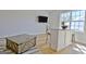 Living room features neutral decor, a coffee table, and a bright window at 446 Bandon Way, Peachtree City, GA 30269