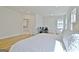 Spacious main bedroom features hardwood floors, a sitting area, a work space, and ensuite bathroom access at 446 Bandon Way, Peachtree City, GA 30269