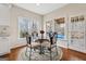 Cozy breakfast nook with a glass table and a view of the outdoor covered patio at 211 Mill Grove Sw Way, Smyrna, GA 30082