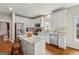 Bright kitchen with white cabinetry, stainless steel appliances, and a granite-topped island at 211 Mill Grove Sw Way, Smyrna, GA 30082