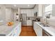 Modern kitchen featuring stainless steel appliances and a center island with a marble countertop at 211 Mill Grove Sw Way, Smyrna, GA 30082