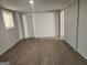 Finished basement showcasing durable floors, neutral paint, and ample lighting throughout the space at 938 King James Dr, Morrow, GA 30260