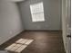 Well-lit bedroom providing durable floors, neutral walls, and comfortable living space at 938 King James Dr, Morrow, GA 30260