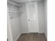 Practical walk-in closet featuring durable flooring and shelving for efficient storage solutions at 938 King James Dr, Morrow, GA 30260
