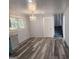 Bright dining area featuring updated flooring, stairs to the upper level and a modern chandelier at 938 King James Dr, Morrow, GA 30260