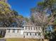 Charming two-story home with a well-maintained yard, a front door and manicured trees at 938 King James Dr, Morrow, GA 30260