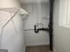 Functional utility room offering practical storage solutions and essential plumbing connections at 938 King James Dr, Morrow, GA 30260