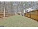 Picture of a backyard with a shed, fenced perimeter, and a covered structure at 1120 Minix Rd, Sharpsburg, GA 30277