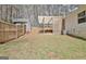 Spacious backyard features a shed, fenced yard, and covered outdoor structure at 1120 Minix Rd, Sharpsburg, GA 30277