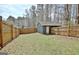 Fenced backyard featuring a shed and ample green space at 1120 Minix Rd, Sharpsburg, GA 30277