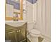 Bathroom featuring neutral vanity, toilet and shower with white tile at 1120 Minix Rd, Sharpsburg, GA 30277