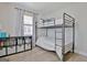 Bedroom featuring a bunk bed, light wood floors and a shelving unit at 1120 Minix Rd, Sharpsburg, GA 30277