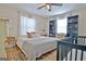 Well-lit bedroom with a ceiling fan, decorative rug, and a crib at 1120 Minix Rd, Sharpsburg, GA 30277