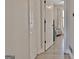 Hallway view leading into a bedroom with wood floors and neutral walls at 1120 Minix Rd, Sharpsburg, GA 30277