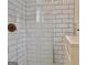 Updated bathroom showcases a modern shower with subway tile and sleek fixtures at 1120 Minix Rd, Sharpsburg, GA 30277