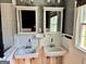 Bathroom featuring dual sinks and windows at 121 Flat Rock Rd, Villa Rica, GA 30180