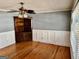 Bedroom featuring hardwood floors, wainscoting and a corner cabinet at 121 Flat Rock Rd, Villa Rica, GA 30180