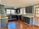 A spacious kitchen features a window over the sink and wood flooring at 121 Flat Rock Rd, Villa Rica, GA 30180