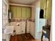 Functional laundry room with cabinets and beadboard walls at 121 Flat Rock Rd, Villa Rica, GA 30180