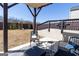 Outdoor patio space with seating and backyard play area, ideal for entertaining at 1127 Lehavre Ct, Hampton, GA 30228