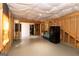 Unfinished basement space with visible framing and a functional refrigerator at 1127 Lehavre Ct, Hampton, GA 30228