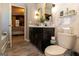 Elegant bathroom features double sinks, granite counters, modern fixtures and stylish mirrors for a spa-like experience at 1127 Lehavre Ct, Hampton, GA 30228